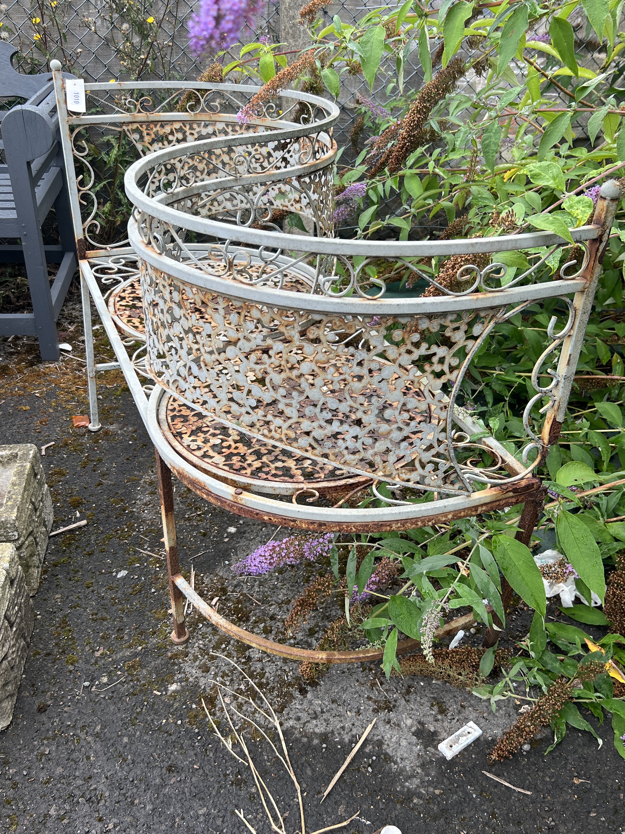 A painted metal garden 'love seat', length 110cm, width 48cm, height 82cm